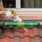 A close-up of Selleys Liquid Nails Construction Adhesive being applied to a wooden surface for a secure and lasting bond.