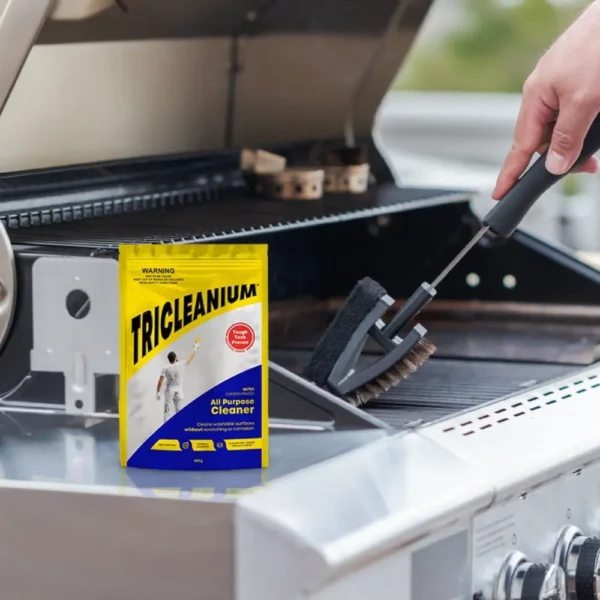 Tricleanium Ultra Concentrated Cleaner 400g next to a BBQ grill - ideal for cleaning grease and tough stains from outdoor surfaces