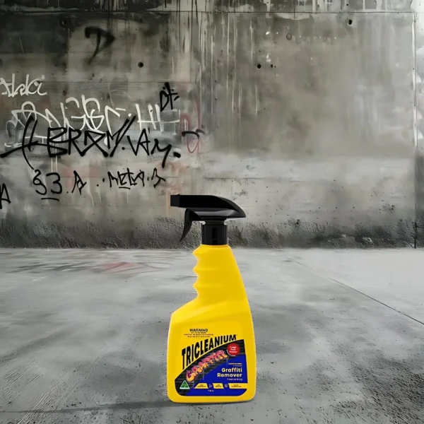 Tricleanium Graffiti Remover 750mL in action on graffiti-covered surface, showing a clean result.