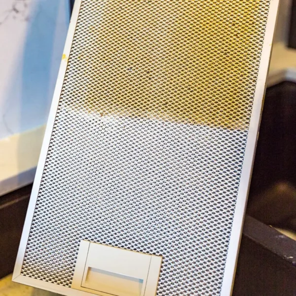 Tricleanium Ultra Concentrated Cleaner 1kg cleaning a mesh filter - powerful cleaner for grease, dirt, and tough stains.