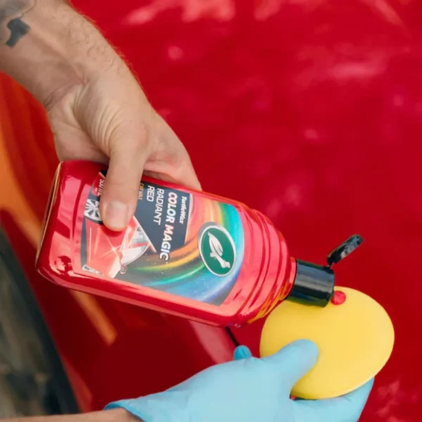 Turtle Wax Color Magic Radiant Red Wax FG52711 500ml next to a red car bonnet, showing polish application on white background