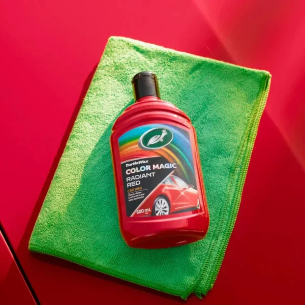 Front view of Turtle Wax Color Magic Radiant Red Wax FG52711 500ml bottle on green and red background