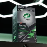 Turtle Wax Ceramic Graphene Paste Wax Kit with applicator beside a shiny black car panel on white background