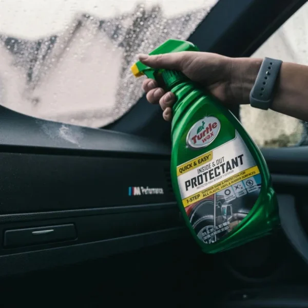 Turtle Wax Quick & Easy Inside & Out Car Protectant 680ml beside a clean dashboard and exterior mirror on white background